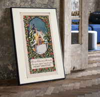 Snow-covered cottage in winter print in a black frame leaning beside a vintage door on parquet