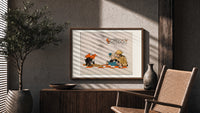 Soldier reading French book with child print in a wood frame above a fluted sideboard beside an olive tree