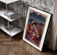 Woman and child at beach poster in a black frame leaning beside a shelf in a raw-plaster loft