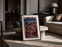 Woman and child at beach print in a black frame leaning on a travertine table in a sunlit lounge