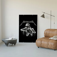 Metallica Decaying Corpse Skeleton poster framed above a tan leather living-room couch