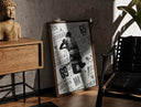 Walnut-framed Michael Jordan slam dunk print leaning against a sunlit rustic brick wall