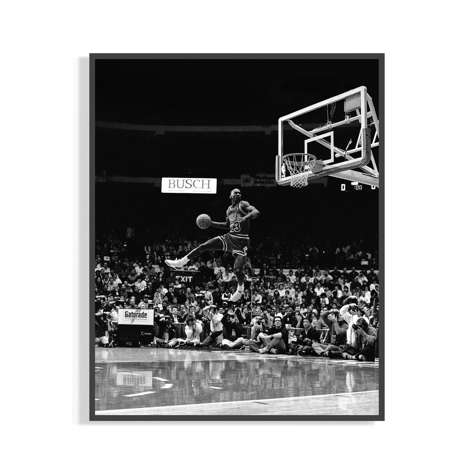 Michael Jordan in midair performing a free throw line slam dunk in dramatic black and white poster photography