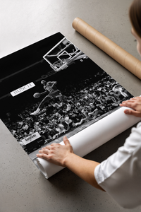 Michael Jordan free throw dunk print displayed next to a protective brown shipping tube on a tabletop