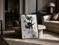 KAWS figure wearing Air Jordan sneakers print in a black frame leaning on a travertine table in a sunlit lounge