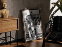Walnut-framed Michael Jordan basketball player print leaning against a sunlit rustic brick wall