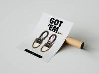 Mocha Air Jordan 1 High OG Cactus Jack poster being partially unrolled from a cardboard tube