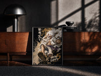 Black-framed Laughing white-haired anime warrior print on a moody console with designer coffee-table books