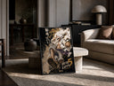 Laughing white-haired anime warrior print in a black frame leaning on a travertine table in a sunlit lounge