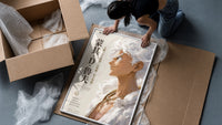 White-haired smiling anime man profile framed print being unpacked from protective bubble wrap and a box