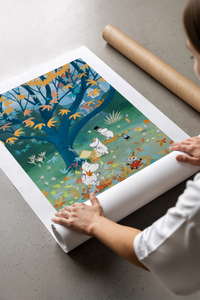 Moomins playing under autumn tree with falling leaves print laid flat in a styling flatlay