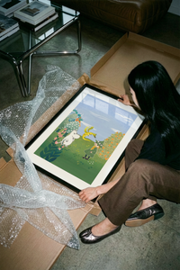 The Moomin character with child in magical garden landscape poster shown across its range of print sizes