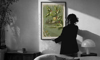 Church A Merry Christmas print in a slim black frame being hung on a sunlit wall in a monochrome room