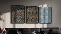 William Morris floral bird patterns triptych in three black frames on a grey wall above a leather sofa