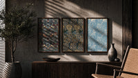 William Morris floral bird patterns triptych in three walnut frames above a sideboard in a warm room