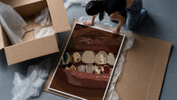 Mouth with Jeweled Gold Grillz framed print being unpacked from protective bubble wrap and a box