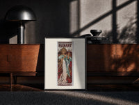 Black-framed Woman holding champagne glass print on a moody console with designer coffee-table books
