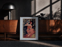 Black-framed Woman with flowing dark hair smoking print on a moody console with designer coffee-table books