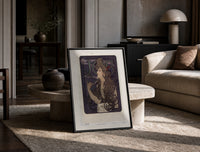 Woman with flowing hair smoking print in a black frame leaning on a travertine table in a sunlit lounge