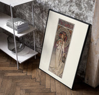 Art Nouveau woman with flowers poster in a black frame leaning beside a shelf in a raw-plaster loft