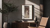 Art Nouveau woman with flowers poster framed above a fluted sideboard beside an olive tree