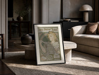 Art Nouveau woman spraying perfume print in a black frame leaning on a travertine table in a sunlit lounge
