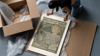 Art Nouveau woman spraying perfume framed print being unpacked from protective bubble wrap and a box