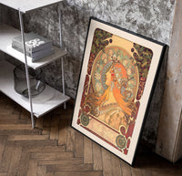 Woman in profile with zodiac halo poster in a black frame leaning beside a shelf in a raw-plaster loft