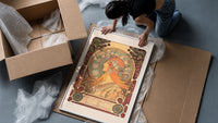 Woman in profile with zodiac halo framed print being unpacked from protective bubble wrap and a box