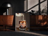 Black-framed My Cup Runneth Over Coffee print on the floor in front of a dark wooden console