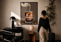 My Cup Runneth Over Coffee print in a black frame on a sunlit plaster wall, a woman looking on beside a mushroom lamp