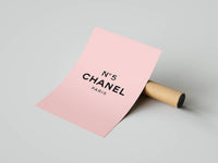 N°5 CHANEL PARIS pink minimalist poster being unrolled from an open cardboard shipping tube