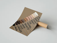 Gently curled Nail Swatches in Brown Tones print beside its protective shipping tube