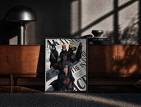 Black-framed Akatsuki ninja characters posing print on a moody console with designer coffee-table books