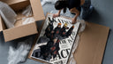 Akatsuki ninja characters posing framed print being unpacked from protective bubble wrap and a box