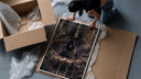 Three legendary ninja anime characters framed print being unpacked from protective bubble wrap and a box