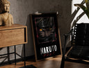 Walnut-framed Naruto Uzumaki close-up face print leaning against a sunlit rustic brick wall