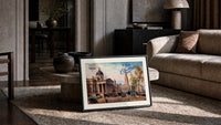London National Gallery vintage cityscape print in a slim black frame leaning on a travertine coffee table