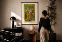 Nativity A Merry Christmas print in a black frame on a sunlit plaster wall, a person looking on beside a mushroom lamp