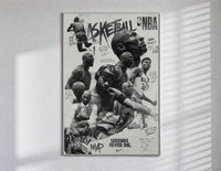 NBA basketball legends collage poster in a slim frame on a bright wall with soft window light