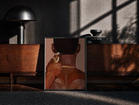 Black-framed Neckline Trim with Clippers print on the floor in front of a dark wooden console