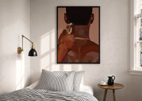 Neckline Trim with Clippers print in a black frame above a bed with striped linens, a brass wall lamp and a sunlit window