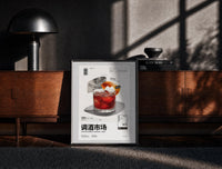 Black-framed Negroni Cocktail Market print on the floor in front of a dark wooden console