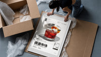 Negroni Cocktail Market framed print being unpacked from protective bubble wrap and a box