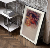 Woman with cymbals and mandolin player poster in a black frame leaning beside a shelf in a raw-plaster loft