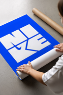 Nike wordmark logo with swoosh graphic print laid flat in a styling flatlay