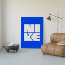 Nike wordmark logo with swoosh graphic poster framed in a luxury living-room setting
