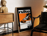 Brass-framed Nike Blazer high-top sneaker print leaning in a warm styled corner by a sculpture