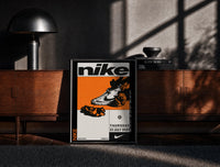 Black-framed Nike Blazer high-top sneaker print on a moody console with designer coffee-table books