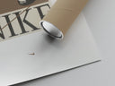 Matte paper-texture close-up of the Nike sneakers footwear advertisement poster print